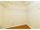 Spacious walk-in closet with wood floors and wire shelving at 10716 Ashford Oaks Dr, Tampa, FL 33625