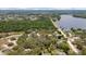 High aerial shot of a residential area with a lake in the background at 11207 Donneymoor Dr, Riverview, FL 33569