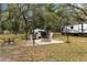 Outdoor area with a patio, fire pit, and ample seating, perfect for relaxation and entertainment with friends and Gathering at 11207 Donneymoor Dr, Riverview, FL 33569