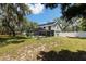 Backyard featuring a screened-in pool area, offering a private oasis for relaxation and entertainment at 11207 Donneymoor Dr, Riverview, FL 33569