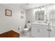 Clean half bath with white vanity, tile floors, and neutral paint at 11207 Donneymoor Dr, Riverview, FL 33569