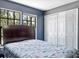 Comfortable bedroom with large windows, a spacious closet and neutral colors at 11207 Donneymoor Dr, Riverview, FL 33569