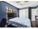 Comfortable bedroom with a spacious closet, large windows, and hardwood flooring at 11207 Donneymoor Dr, Riverview, FL 33569
