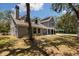 Charming two-story home with a brick facade and mature landscaping at 11207 Donneymoor Dr, Riverview, FL 33569