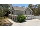 Beautiful home with an attached three-car garage and lush greenery at 11207 Donneymoor Dr, Riverview, FL 33569