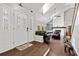 Inviting foyer with double glass doors and view of the living room and fireplace at 11207 Donneymoor Dr, Riverview, FL 33569