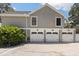 Spacious three-car garage with ample storage space at 11207 Donneymoor Dr, Riverview, FL 33569