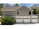 Spacious three-car garage with ample storage space at 11207 Donneymoor Dr, Riverview, FL 33569
