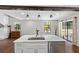 Bright kitchen island features marble countertop, stainless steel dishwasher, and sink with pendant lighting above at 11207 Donneymoor Dr, Riverview, FL 33569