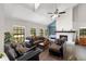 Bright and airy living room features a fireplace, large windows, high ceilings, and hardwood floors at 11207 Donneymoor Dr, Riverview, FL 33569