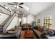 Expansive living room featuring high ceilings, a staircase, hardwood floors, and large windows for natural light at 11207 Donneymoor Dr, Riverview, FL 33569