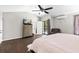 Bright main bedroom offers access to the backyard, a sitting area, hardwood floors and a vaulted ceiling at 11207 Donneymoor Dr, Riverview, FL 33569