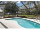 Inviting screened-in pool area features a sparkling pool, surrounded by lush greenery for ultimate privacy at 11207 Donneymoor Dr, Riverview, FL 33569
