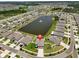 Beautiful aerial view of a home near a serene community pond in a well-planned neighborhood at 11924 Brighton Knoll Loop, Riverview, FL 33579