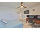 Nicely decorated bedroom with ceiling fan, light blue quilt, and desk at 11924 Brighton Knoll Loop, Riverview, FL 33579