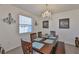 Elegant dining room with a wooden table, chairs, chandelier, and tasteful decor at 11924 Brighton Knoll Loop, Riverview, FL 33579