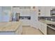 Bright kitchen with stainless steel appliances, granite countertops, and ample cabinet space at 11924 Brighton Knoll Loop, Riverview, FL 33579
