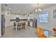 Spacious kitchen with granite countertops, a center island, and modern stainless steel appliances at 11924 Brighton Knoll Loop, Riverview, FL 33579