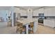 Modern kitchen with stainless steel appliances, granite countertops, and center island with seating at 11924 Brighton Knoll Loop, Riverview, FL 33579