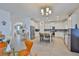 Bright, open kitchen with stainless steel appliances, a center island, and white cabinetry at 11924 Brighton Knoll Loop, Riverview, FL 33579