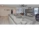Comfortable living room with a large sectional sofa, entertainment center, and plenty of space for relaxation at 11924 Brighton Knoll Loop, Riverview, FL 33579