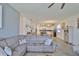 Cozy living room with comfortable seating and an open floor plan leading to a modern kitchen at 11924 Brighton Knoll Loop, Riverview, FL 33579