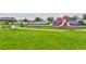Well-maintained playground area with slides, swings, and a covered picnic spot on lush green grass at 11924 Brighton Knoll Loop, Riverview, FL 33579