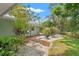 Well-manicured backyard featuring attractive landscaping and peaceful setting at 1240 Harbor Lake Dr, Largo, FL 33770