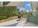 Backyard featuring an outdoor cooking area, wooden deck and beautiful landscaping at 1240 Harbor Lake Dr, Largo, FL 33770