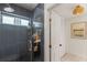 Custom shower with window and modern bathroom fixtures, and linen closet at 1240 Harbor Lake Dr, Largo, FL 33770