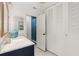 Charming bathroom with custom vanity, linen closet and glass-enclosed shower at 1240 Harbor Lake Dr, Largo, FL 33770