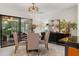 Cozy dining room with sliding glass doors to a lanai and modern light fixture at 1240 Harbor Lake Dr, Largo, FL 33770