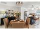 Open dining area with round table, seating for four, and a view of the modern kitchen at 1240 Harbor Lake Dr, Largo, FL 33770