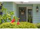 Close up of welcoming front door decorated with a lovely floral basket at 1240 Harbor Lake Dr, Largo, FL 33770
