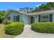 Inviting front entrance with decorative wreath and neatly trimmed bushes at 1240 Harbor Lake Dr, Largo, FL 33770