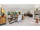 Bright living room with modern decor, tile floors, and ample natural light at 1240 Harbor Lake Dr, Largo, FL 33770