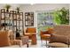 Cozy living room featuring stylish shelving units and comfortable seating at 1240 Harbor Lake Dr, Largo, FL 33770