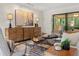 Beautifully furnished living room with modern decor and seamless access to screened patio at 1240 Harbor Lake Dr, Largo, FL 33770
