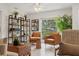 Cozy living room featuring stylish shelving units and comfortable seating at 1240 Harbor Lake Dr, Largo, FL 33770