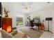 Well-lit home office with desk, ceiling fan, and backyard view at 1240 Harbor Lake Dr, Largo, FL 33770