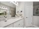 Bathroom featuring a vanity with a sink, a large mirror, and a glass shower for convenience at 12817 Cobalt Ter, Bradenton, FL 34211