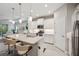 Bright kitchen with marble countertops, stainless appliances, and seating at island at 12817 Cobalt Ter, Bradenton, FL 34211
