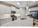 Modern kitchen featuring stainless steel appliances, marble countertops, and hanging lights at 12817 Cobalt Ter, Bradenton, FL 34211