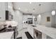 Well-equipped kitchen with stainless appliances, granite countertops and white cabinetry at 12817 Cobalt Ter, Bradenton, FL 34211
