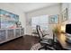 Office space with desk, executive chair, dark hardwood floors, and decorative accent pieces at 12817 Cobalt Ter, Bradenton, FL 34211