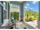 Charming porch with seating and view into the landscaped yard, creating an inviting outdoor space at 12817 Cobalt Ter, Bradenton, FL 34211