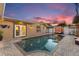 Backyard pool with outdoor lighting, outdoor furniture, and a beautiful deck perfect for relaxation at 13035 91St Ave, Seminole, FL 33776