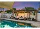 Sparkling pool surrounded by stylish lounge seating and pergola, creating a tranquil outdoor oasis at 13035 91St Ave, Seminole, FL 33776