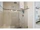 Bathroom shower features glass door, modern tile, and dual showerheads for a spa-like experience at 13035 91St Ave, Seminole, FL 33776