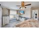 Inviting bedroom with a ceiling fan, storage, and large window providing natural light at 13035 91St Ave, Seminole, FL 33776
